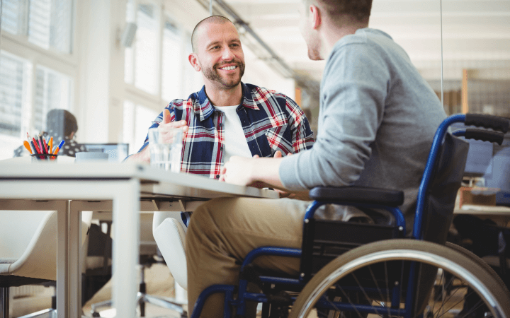 A man in a wheelchair discusses NDIS SDA housing options