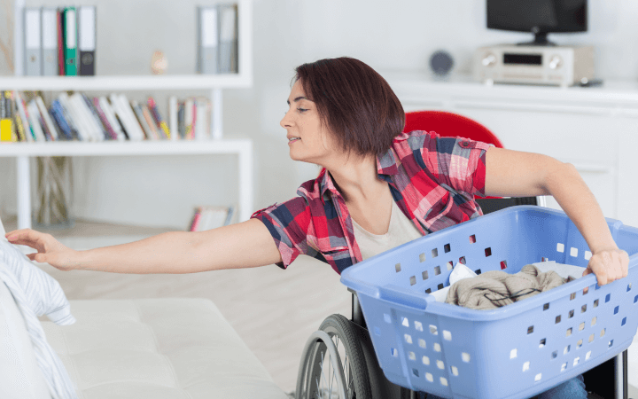 A woman in a wheelchair moves easily around a NDIS SDA Improved Liveability home